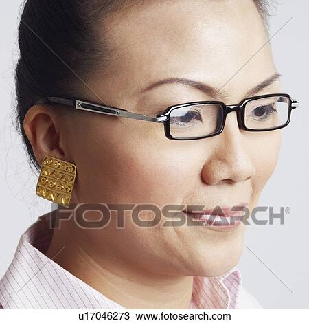 Close-up of a businesswoman thinking View Large Photo Image Stock Image - Close-up of a businesswoman thinking. Fotosearch