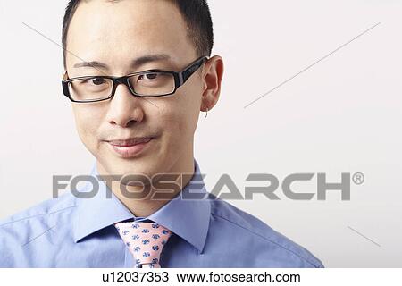 Stock Image - Portrait of a businessman smiling. Fotosearch