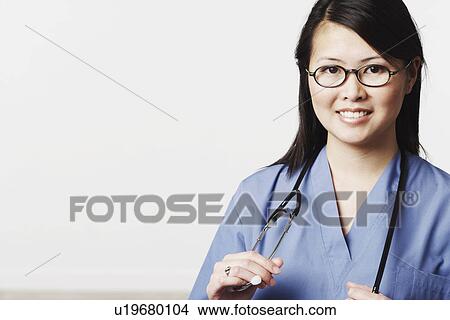 Picture - Portrait of a female doctor smiling. Fotosearch