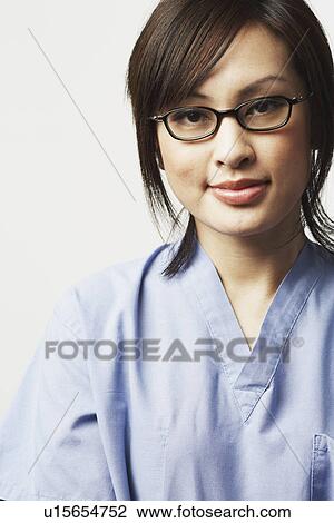 Stock Image - Portrait of a female doctor smiling. Fotosearch