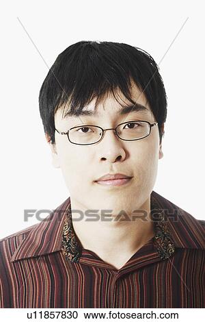 Portrait of a serious young man View Large Photo Image Stock Image - Portrait of a serious young man. Fotosearch