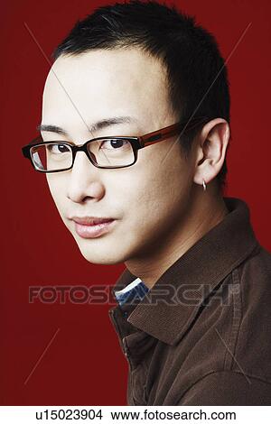 Picture - Portrait of a young man grinning. Fotosearch