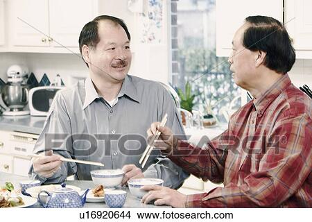 Picture - Close-up of two senior men at the table. Fotosearch