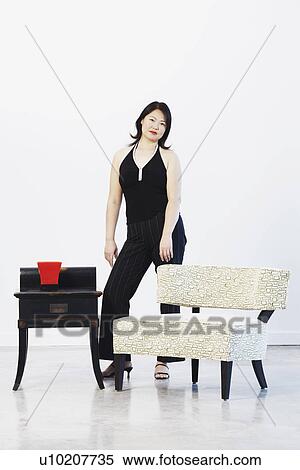 Portrait of a mid adult woman posing View Large Photo Image Stock Photography - Portrait of a mid adult woman posing. Fotosearch