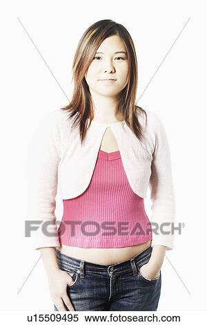 Portrait of a mid adult woman standing with her hands in her pockets View Large Photo Image Stock Photography - Portrait of a mid adult woman standing with her hands in her pockets. Fotosearch