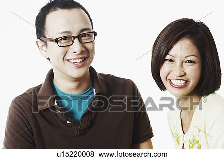 Stock Photo - Portrait of a young couple smiling. Fotosearch