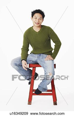 Portrait of a young man smiling View Large Photo Image Stock Photo - Portrait of a young man smiling. Fotosearch