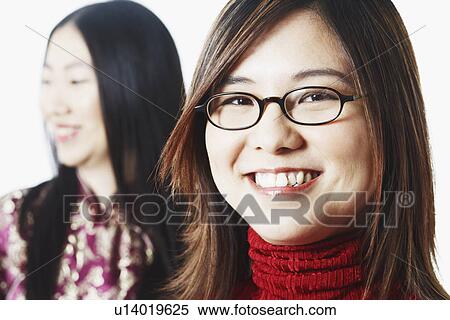 Stock Photography - Portrait of a young woman smiling. Fotosearch