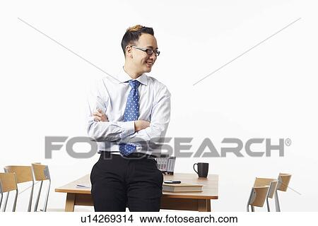 Close-up of a businessman smiling View Large Photo Image Picture - Close-up of a businessman smiling. Fotosearch