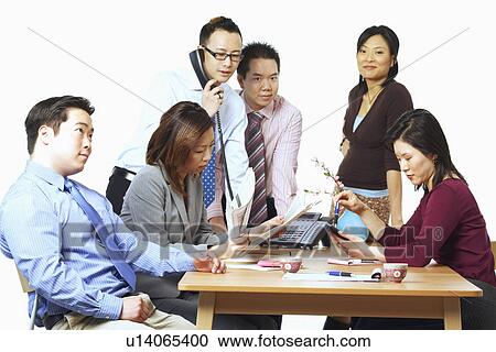 Three businessmen and three businesswomen in a meeting View Large Photo Image Stock Image - Three businessmen and three businesswomen in a meeting. Fotosearch