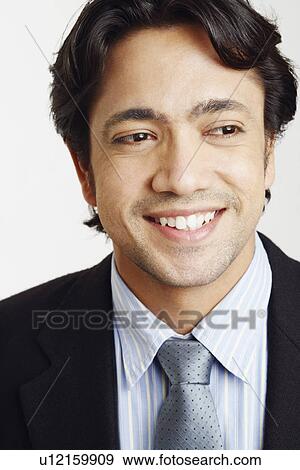 Stock Photo - Close-up of a businessman smiling. Fotosearch