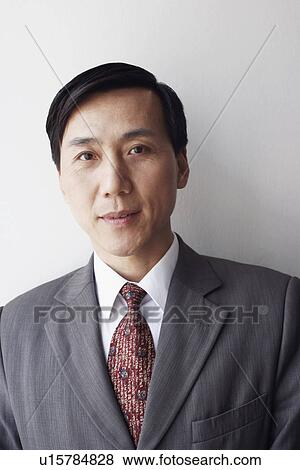 Stock Photo - Portrait of a businessman looking serious. Fotosearch