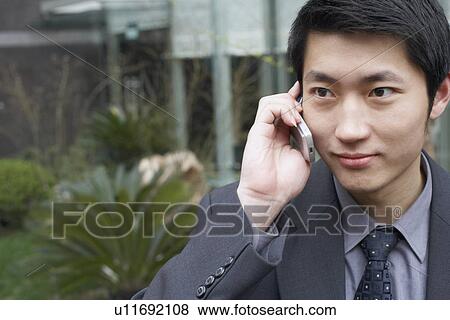Close-up of a businessman using a mobile phone View Large Photo Image Stock Photo - Close-up of a businessman using a mobile phone. Fotosearch