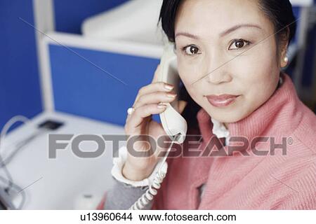 Portrait of a businesswoman talking on the telephone View Large Photo Image Picture - Portrait of a businesswoman talking on the telephone. Fotosearch