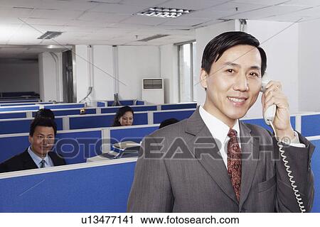 Business executives working in an office View Large Photo Image Stock Image - Business executives working in an office. Fotosearch