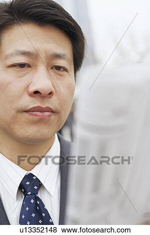 Close-up of a businessman reading a newspaper View Large Photo Image Stock Photo - Close-up of a businessman reading a newspaper. Fotosearch