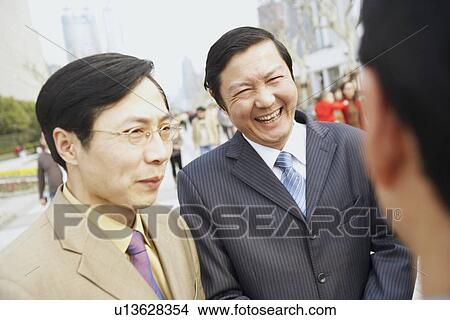Close-up of two businessmen smiling View Large Photo Image Picture - Close-up of two businessmen smiling. Fotosearch