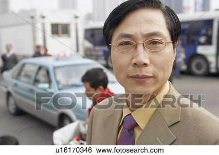 Stock Photograph - Portrait of a businessman. Fotosearch