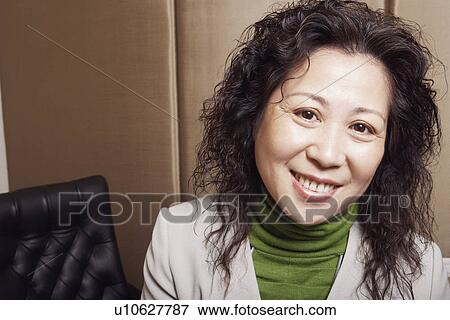 Portrait of a businesswoman smiling View Large Photo Image Stock Photo - Portrait of a businesswoman smiling. Fotosearch