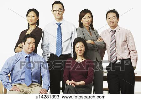 Stock Image - Portrait of three businesswomen and three businessmen smiling. Fotosearch