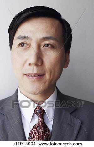 Picture - Close-up of a businessman looking away. Fotosearch