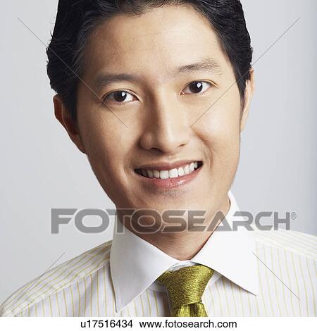 Picture - Portrait of a businessman smiling. Fotosearch