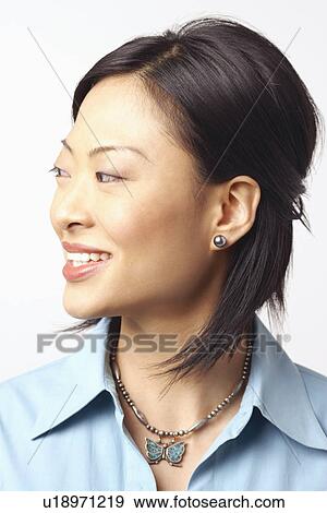 Stock Photo - Close-up of a businesswoman looking sideways. Fotosearch