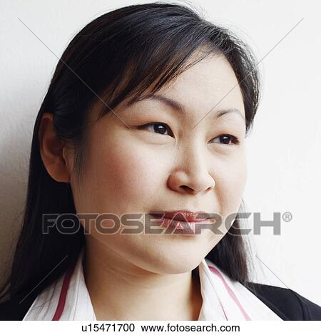 Close-up of a businesswoman smiling View Large Photo Image Stock Image - Close-up of a businesswoman smiling. Fotosearch