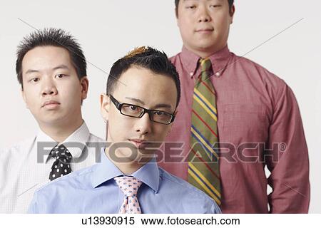 Stock Photography - Close-up of three businessmen. Fotosearch