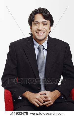 Stock Photo - Portrait of a businessman smiling. Fotosearch