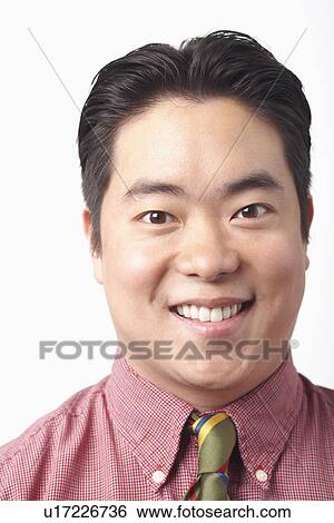 Portrait of a businessman smiling View Large Photo Image Stock Photograph - Portrait of a businessman smiling. Fotosearch