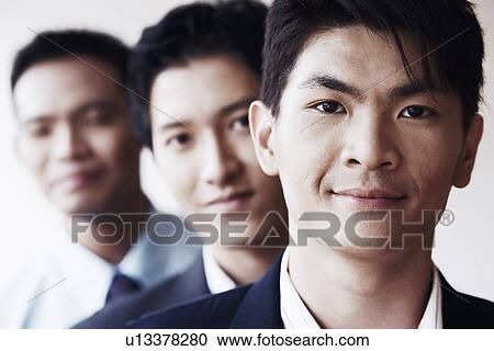 Portrait of three businessmen smiling View Large Photo Image Stock Image - Portrait of three businessmen smiling. Fotosearch