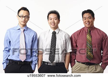 Portrait of three businessmen smiling View Large Photo Image Stock Photo - Portrait of three businessmen smiling. Fotosearch