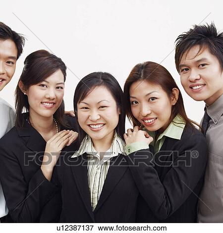 Stock Photo - Portrait of three businesswomen and two businessmen smiling. Fotosearch