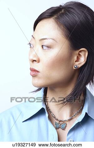 Close-up of a businesswoman looking sideways View Large Photo Image Stock Photo - Close-up of a businesswoman looking sideways. Fotosearch