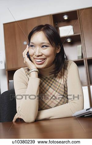 Close-up of a businesswoman using a mobile phone View Large Photo Image Stock Photo - Close-up of a businesswoman using a mobile phone. Fotosearch