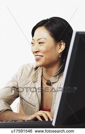 Close-up of a businesswoman using a computer View Large Photo Image Stock Photograph - Close-up of a businesswoman using a computer. Fotosearch