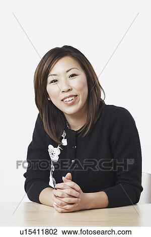 Stock Image - Portrait of a businesswoman smiling. Fotosearch