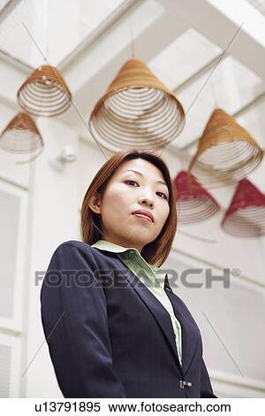 Stock Photography - Portrait of a businesswoman standing. Fotosearch