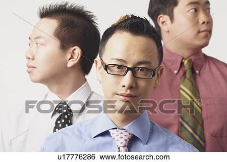 Stock Photograph - Close-up of three businessmen. Fotosearch