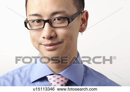 Stock Photograph - Portrait of a businessman smiling. Fotosearch