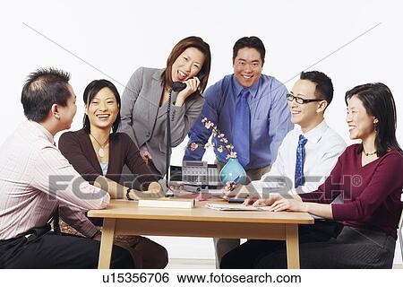 Three businessmen and three businesswomen in a meeting View Large Photo Image Stock Photograph - Three businessmen and three businesswomen in a meeting. Fotosearch