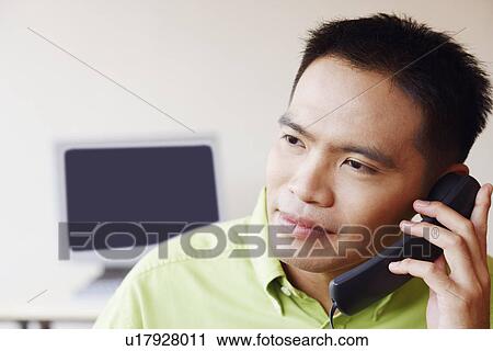 Close-up of a businessman talking on the telephone View Large Photo Image Stock Image - Close-up of a businessman talking on the telephone. Fotosearch