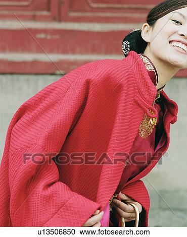 Portrait of a young woman smiling View Large Photo Image Stock Image - Portrait of a young woman smiling. Fotosearch