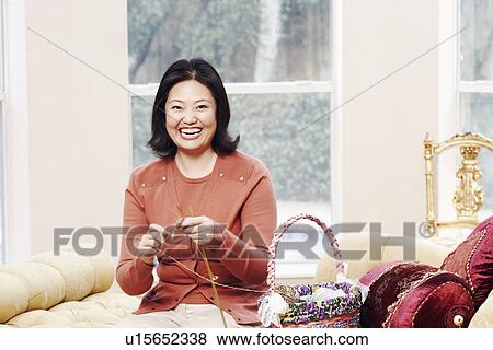 Portrait of a mature woman knitting View Large Photo Image Stock Photo - Portrait of a mature woman knitting. Fotosearch