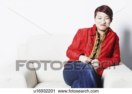 Stock Image - Young woman smiling. Fotosearch