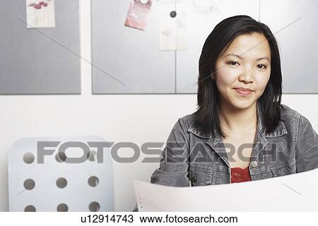 Portrait of a businesswoman smiling View Large Photo Image Stock Image - Portrait of a businesswoman smiling. Fotosearch