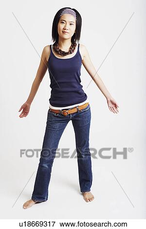 Portrait of a young woman posing View Large Photo Image Stock Photo - Portrait of a young woman posing. Fotosearch