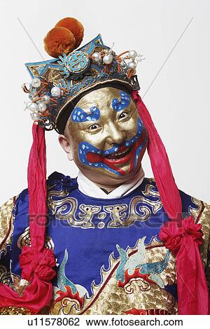 Stock Image - Portrait of a male Chinese opera performer smiling. Fotosearch