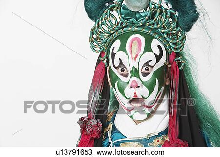 Stock Image - Portrait of a male Chinese opera performer with his mouth open. Fotosearch